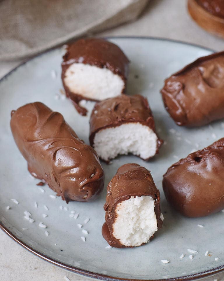 Vegan chocolate and coconut Bounty-style bars laying on a plate
