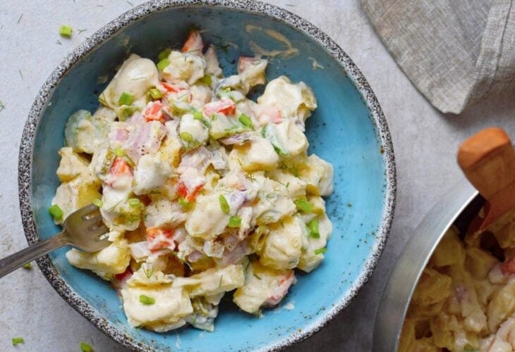 A bowl of healthy creamy vegan potato salad by ElaVegan