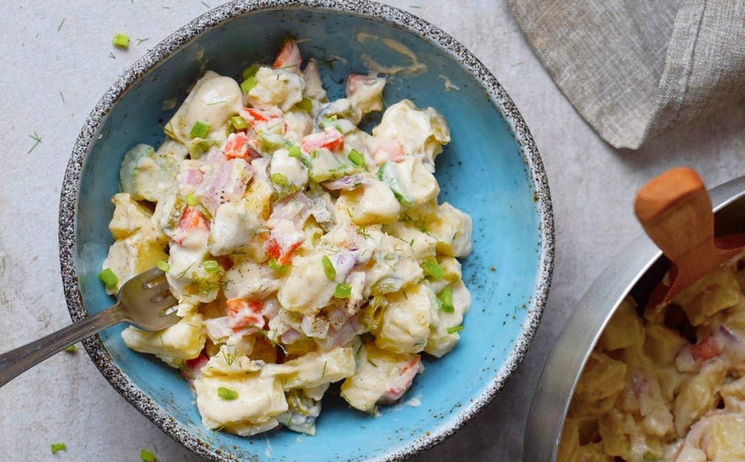 A bowl of healthy creamy vegan potato salad by ElaVegan