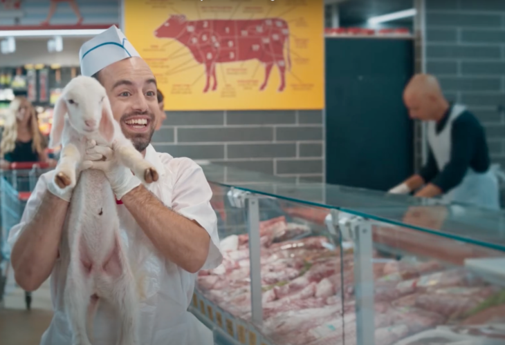 A man holds up a live lamb at a butchers counter, as part of the Vegan Friendly viral advert which first screened in Israel last year