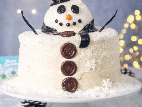 Premium Photo | Christmas cake prepared with sugar paste with snowman  christmas tree and gift figures on it
