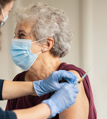 Woman taking the COVID-19 vaccine