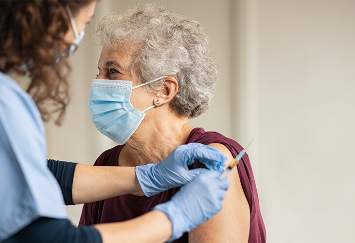 Woman taking the COVID-19 vaccine