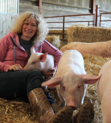 Viva! founder Juliet Gellatley with some pigs