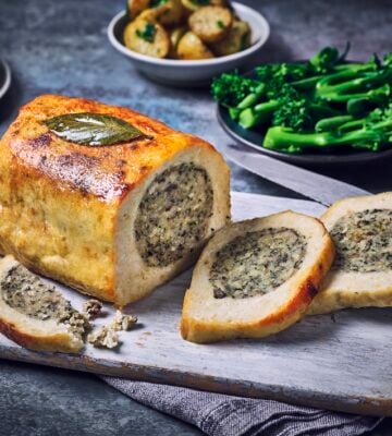 A vegan roast carved on a plate with stuffing, part of Marks & Spencers' Plant Kitchen dine-in deal for Mother's Day