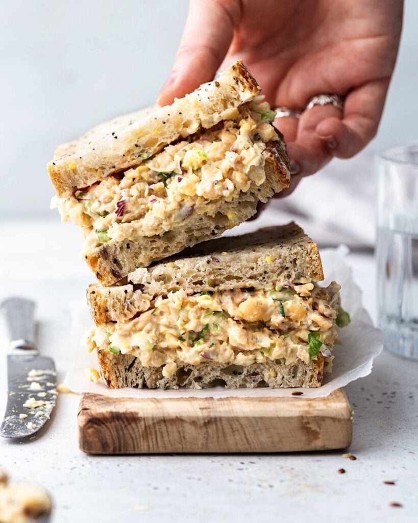 A wholegrain vegan chickpea tuna mayo sandwich being served