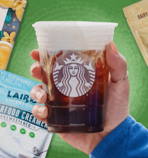 various vegan non-dairy creamers behind a Starbucks coffee cup on a green backdrop