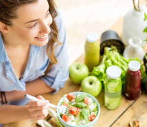 Woman Eats Healthy Vegan Bowl