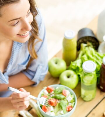 Woman Eats Healthy Vegan Bowl