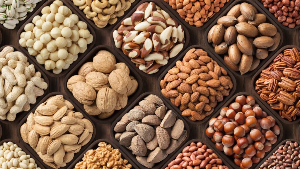 A selection of different types of nuts, including almonds and walnuts 