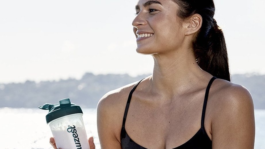 woman-holds-protein-shaker