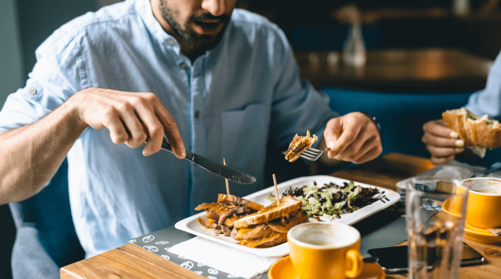 man eating food at a table