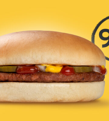 Burger in bun on yellow background with 99p in black behind