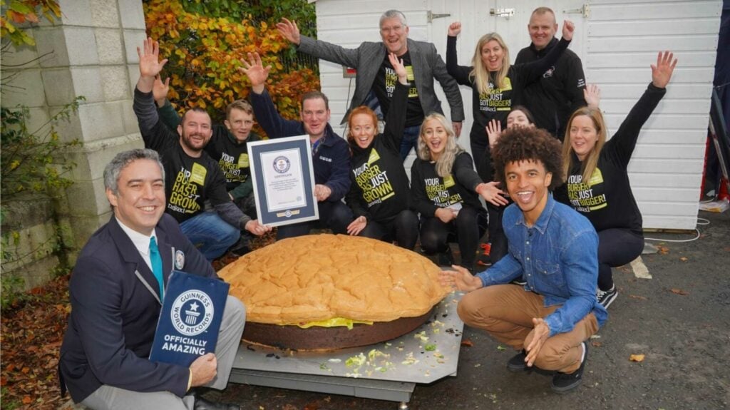 giant vegan burger with employees and Guinness World Record staff