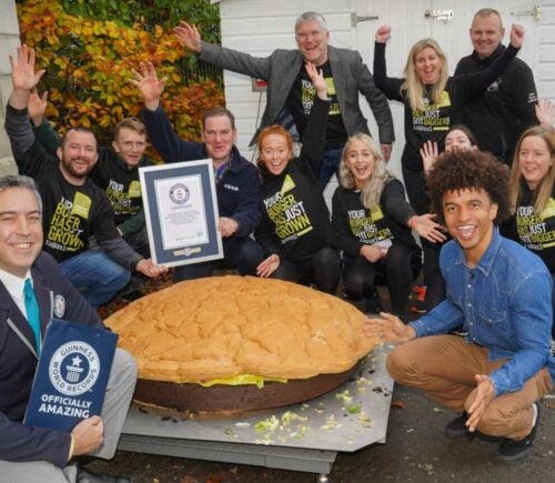 giant vegan burger with employees and Guinness World Record staff