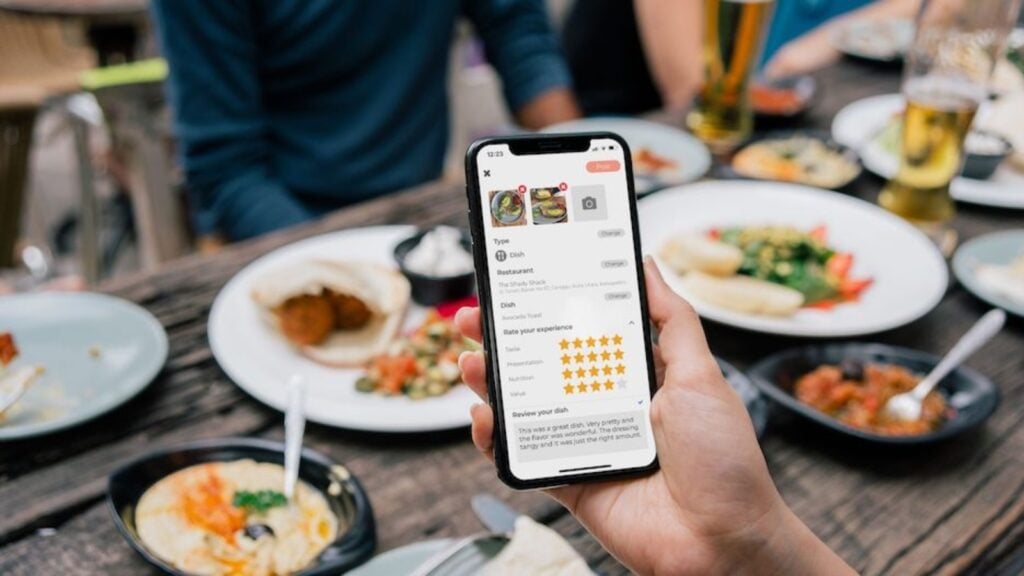 person using abillion app to rate food