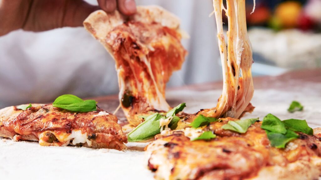 Pizza with cheese made from milk proteins using microorganisms instead of cows