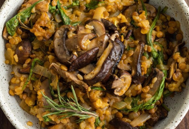 Vegan lentil and mushroom risotto served with fresh thyme sprigs
