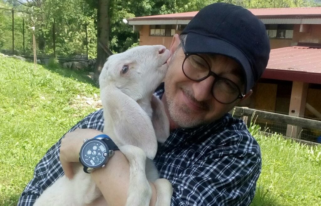 Animal sanctuary owner Andrea Cisternino with a goat