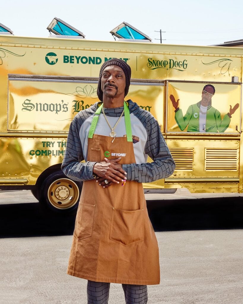 Snoop Dogg standing in front of a Beyond Meat food truck