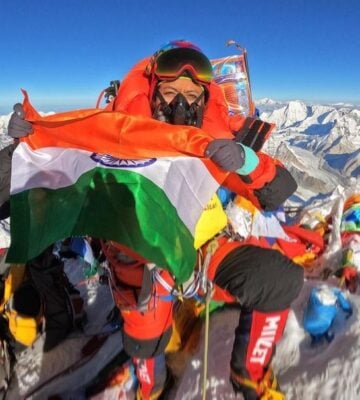 Prakriti Varshney holds the Indian flag at the top of Everest