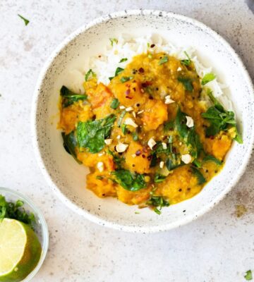 lentil and butternut squash curry with rice in a bowl
