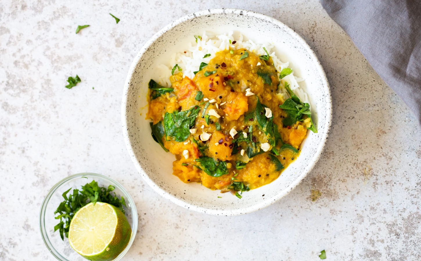 lentil and butternut squash curry with rice in a bowl