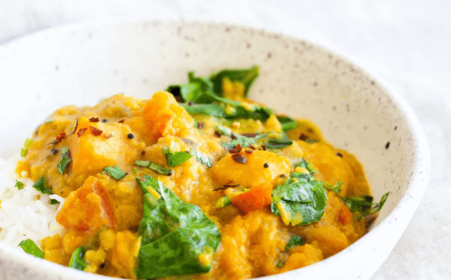 A vegan red lentil and butternut squash Indian curry, cooked in an instant pot from a plant-based recipe