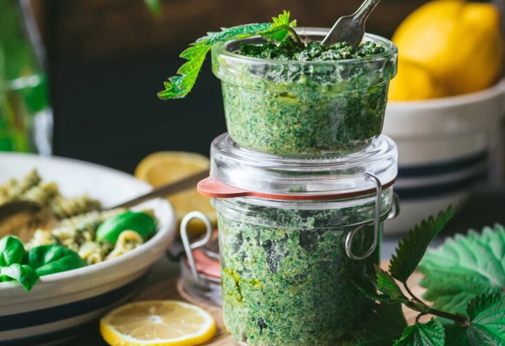 pots of vegan stinging nettle pesto from a plant-based recipe