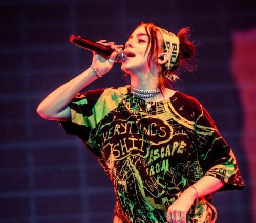 Vegan singer-songwriter Billie Eilish performing in green outfit