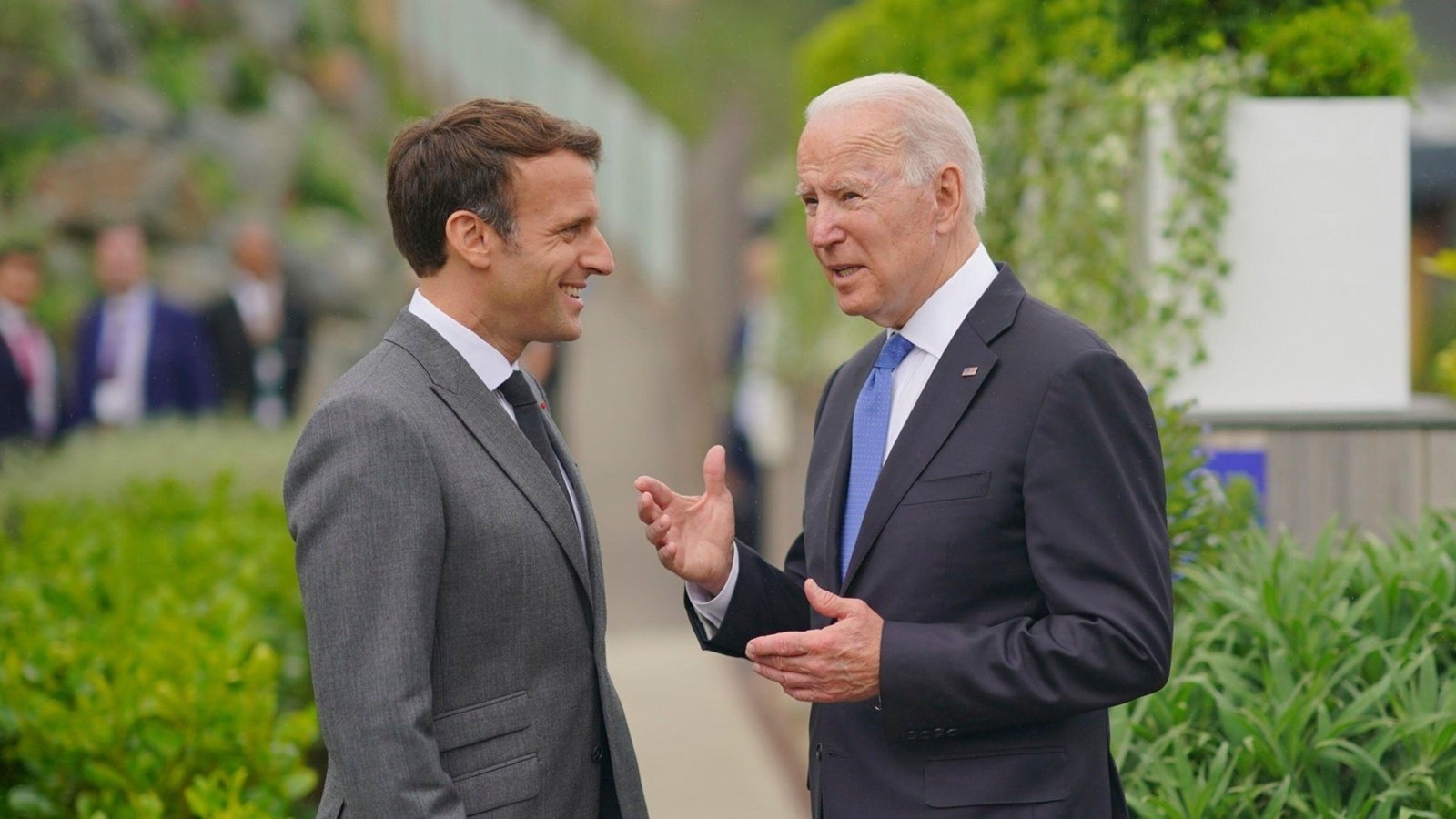 French President Emmanuel Macron speaks with US President Joe Biden