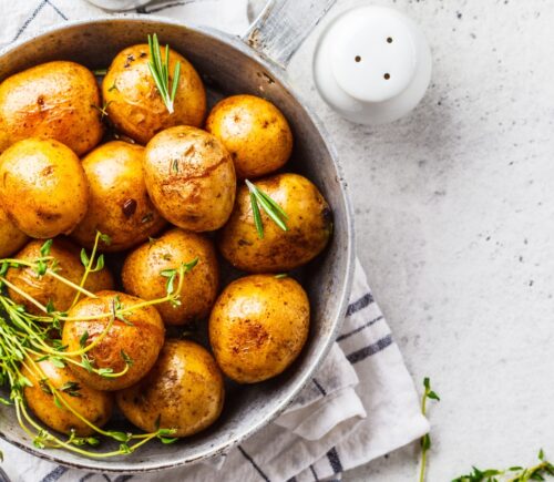 potatoes and herbs in a bowl