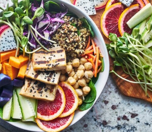 a buddha bowl filled with plant-based ingredients