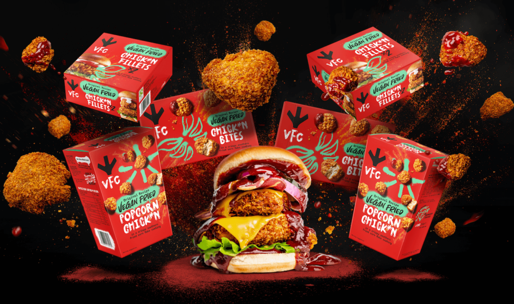 Boxes of VFC's vegan fried chicken around a burger