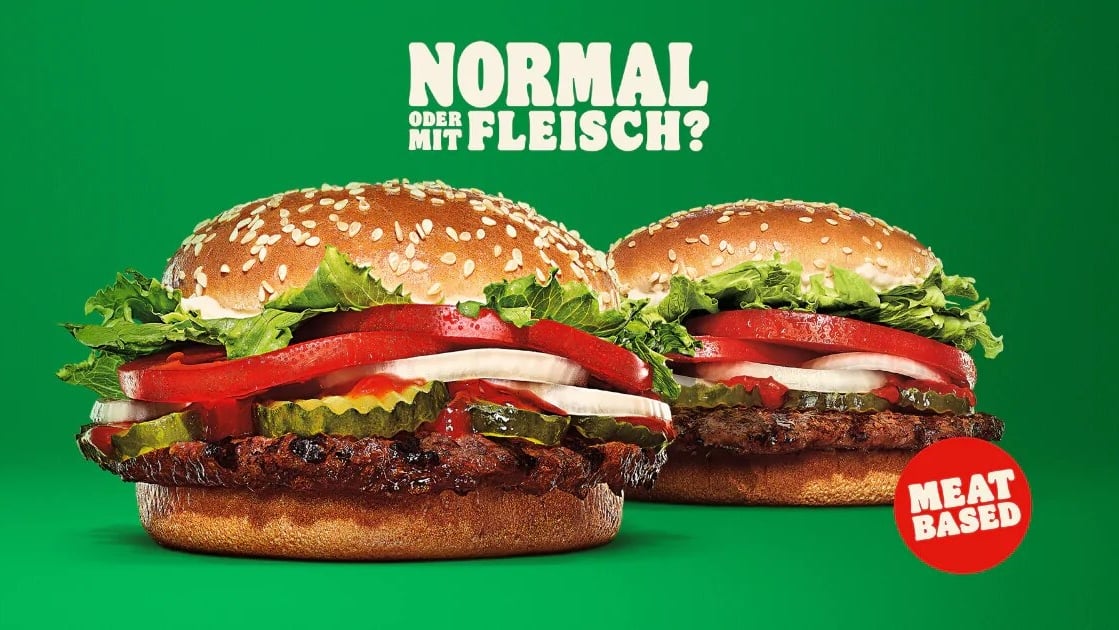 A campaign poster for Burger King Austria that reads "Normal Oder Mit Fleisch?"