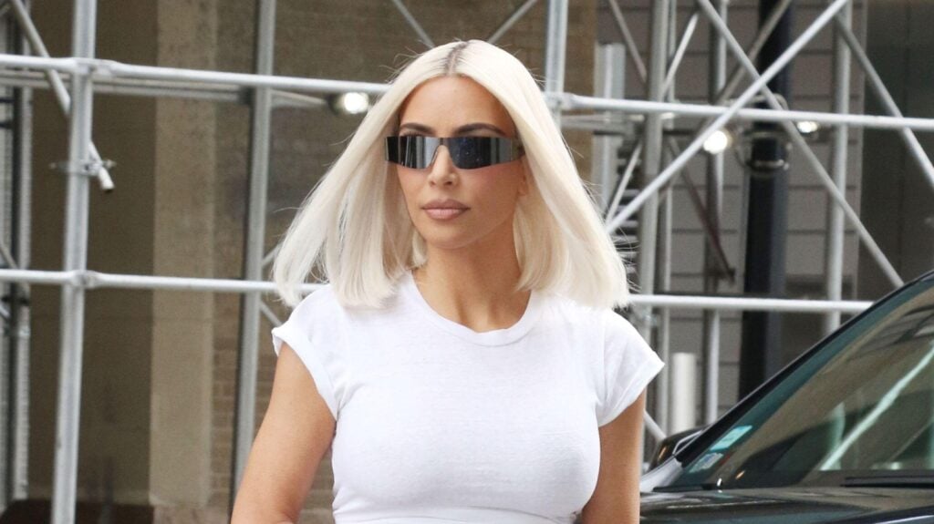 Kim Kardashian with blonde hair and sunglasses