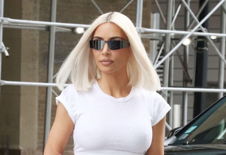 Kim Kardashian with blonde hair and sunglasses