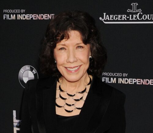 Lily Tomlin smiles on the red carpet