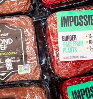 A packet of Beyond Beef beside Impossible Foods' meat