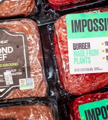 A packet of Beyond Beef beside Impossible Foods' meat
