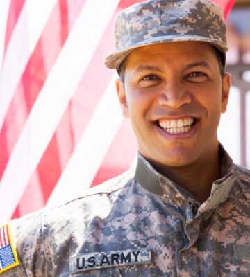 portrait of happy us army soldier outdoors