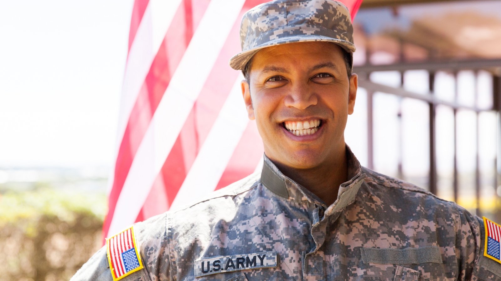 portrait of happy us army soldier outdoors