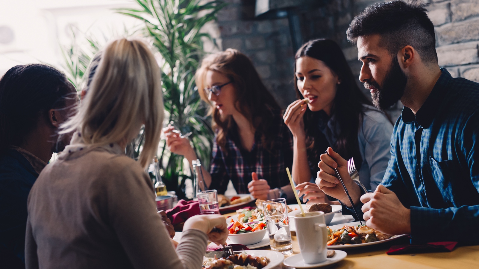 Group of people eating in restaurant