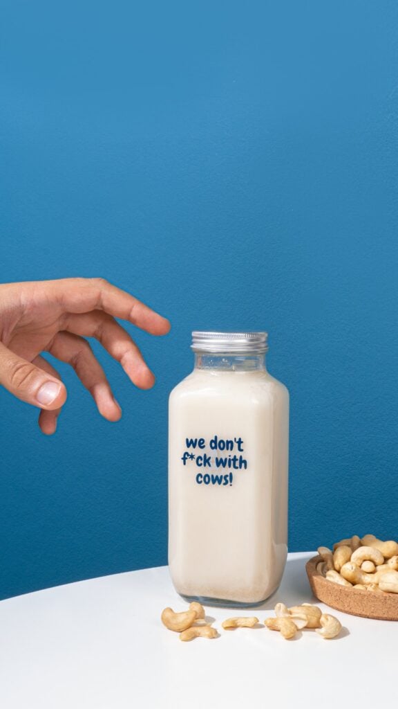 A bottle of dairy-free Milky Plant milk that says 'we don't f*ck with cows'