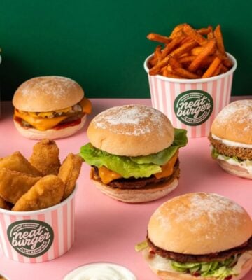 Vegan food brand Neat Burger meals, including a spread of burgers and fries
