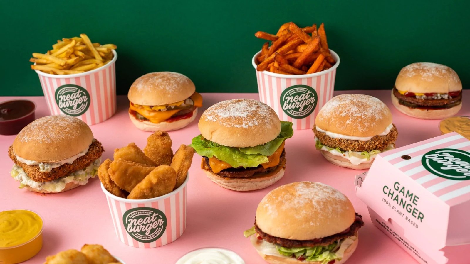 Vegan food brand Neat Burger meals, including a spread of burgers and fries