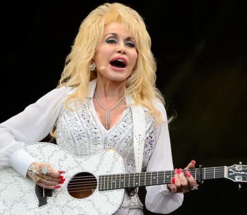 Dolly Parton plays guitar at Glastonbury music festival