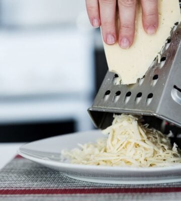 a hand grating cheese