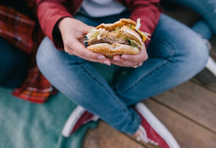 A woman eating a burger