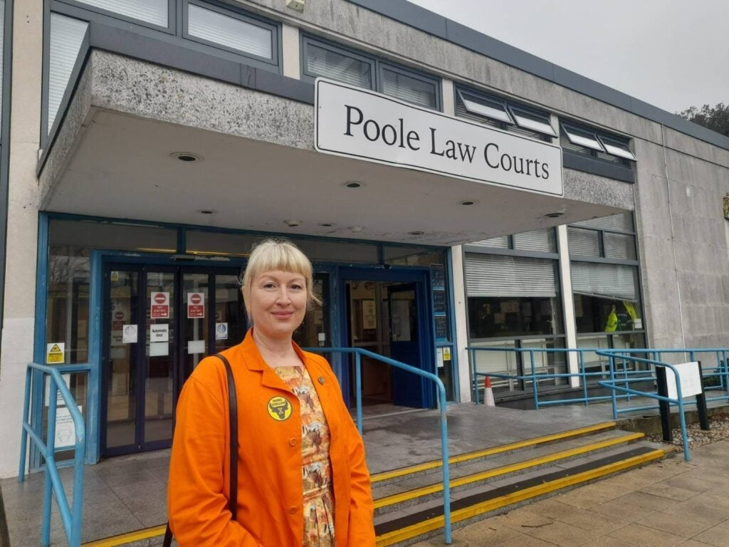 Vegan climate activist and Animal Rebellion member Emma Smart standing outside of Poole Law Courts following her David Attenborough encounter
